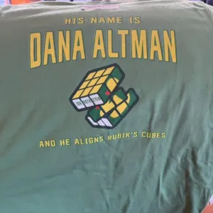 Rubik his nam is Dana Altman and he aligns Rubik's cubes shirt