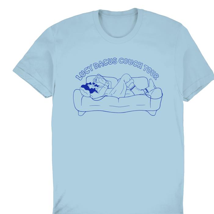 Lucy Dacus couch tour sing song lie sofa shirt