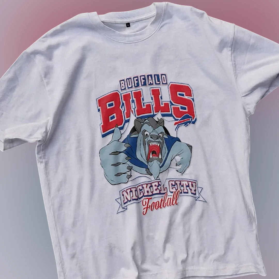 Buffalo Bills Nickel City Football Tee Vintage Beast Mascot Game Day Graphic Shirt available at our Los Angeles warehouse