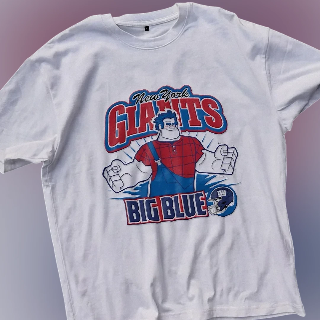 New York Giants Big Blue Tee Wreck-It Ralph Vintage Football — Los Angeles New York Giants Big Blue Tee Wreck-It Ralph Vintage Football Fan Graphic Shirt available at our Los Angeles warehouse