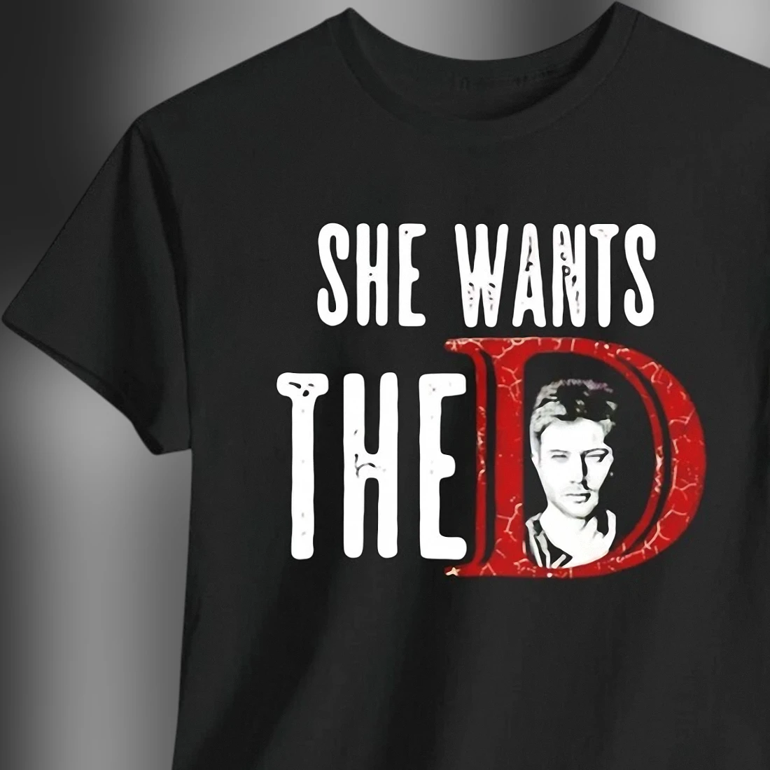 she-wants-the-d-jensen-ackles-graphic-tee-funny-dean-winchester-meme-fandom-shir.webp She Wants The D Jensen Ackles Graphic Tee, Funny Dean Winchester Meme Fandom Shirt for Women and Men