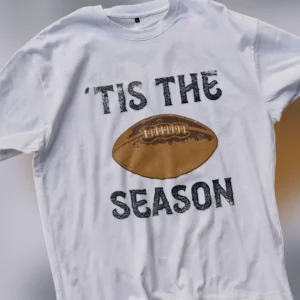 'Tis The Season Football Graphic Tee, Vintage Game Day Distressed Sports Shirt Gift available at our Los Angeles warehouse