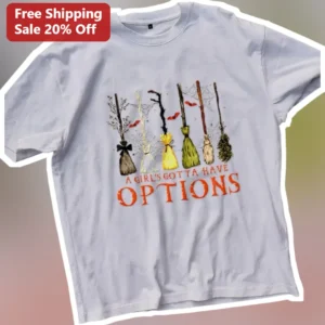 A Girl's Gotta Have Options Witch Broom Graphic Tee Retro Halloween Shirt for Women available at our Los Angeles warehouse