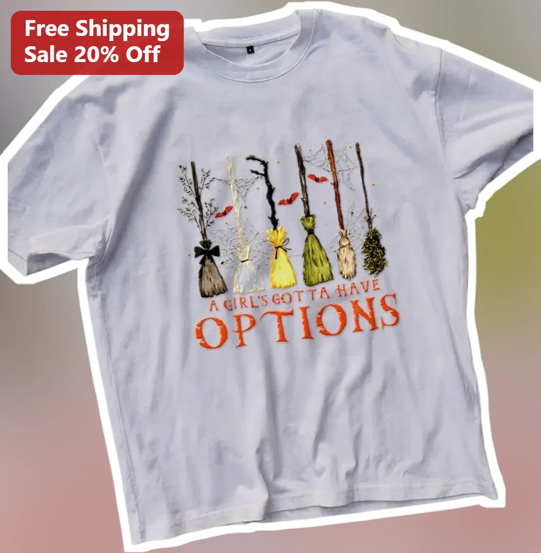 A Girl's Gotta Have Options Witch Broom Graphic Tee Retro Ha — Los Angeles A Girl's Gotta Have Options Witch Broom Graphic Tee Retro Halloween Shirt for Women available at our Los Angeles warehouse