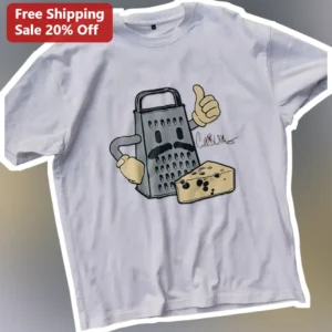 Cartoon Cheese Grater Mascot Graphic Tee Funny Kitchen Gadget Shirt for Chefs and Foodies available at our Los Angeles warehouse