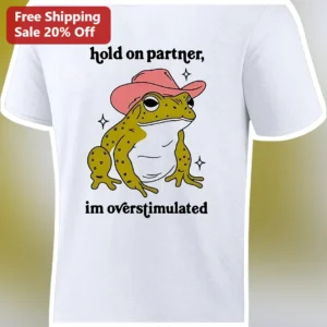 Hold On Partner Im Overstimulated Cowboy Frog Graphic Tee Funny Meme Shirt Gift available at our Los Angeles warehouse