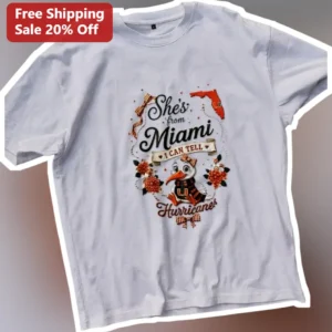 She's From Miami I Can Tell Hurricanes Graphic Tee Women College Fan Gift available at our Los Angeles warehouse