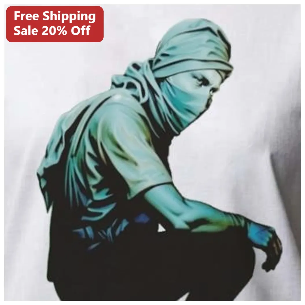 Crouching Masked Figure Streetwear Art Tee Urban Ninja Graphic Shirt available at our Los Angeles warehouse