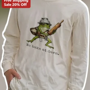 We Bake At Dawn Frog Baker Long Sleeve Tee Cottagecore Early Morning Gift available at our Los Angeles warehouse