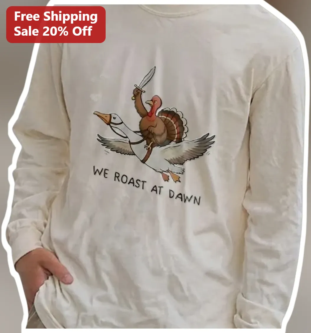 We Roast At Dawn Funny Thanksgiving Turkey Goose Rider Long Sleeve Tee Coffee Lover Gift available at our Los Angeles warehouse